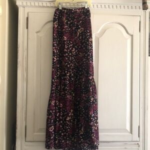 Lightweight maxi skirt with faux button up detail and ruffle bottom.